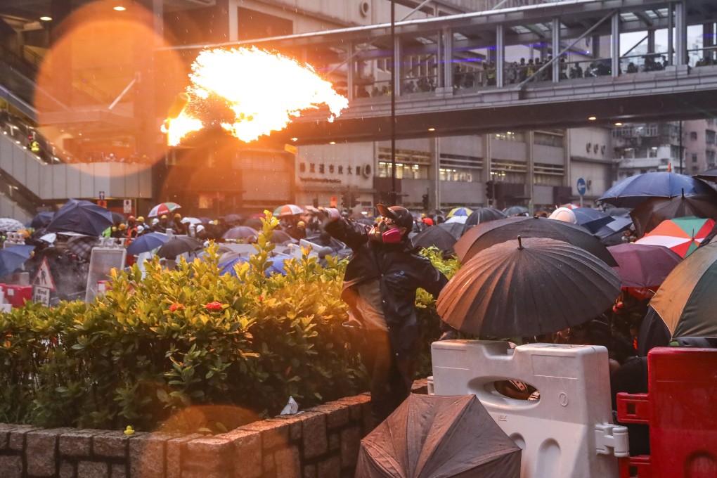 Anti-government protesters throw petrol bombs at police as they clash in Tsuen Wan after a march from Kwai Chung Sports Ground to Tsuen Wan Park on August 25. Photo: Dickson Lee