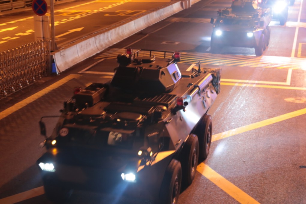 PLA military vehicles pass into Hong Kong at Huanggang Port in the early hours of Thursday. Photo: Xinhua