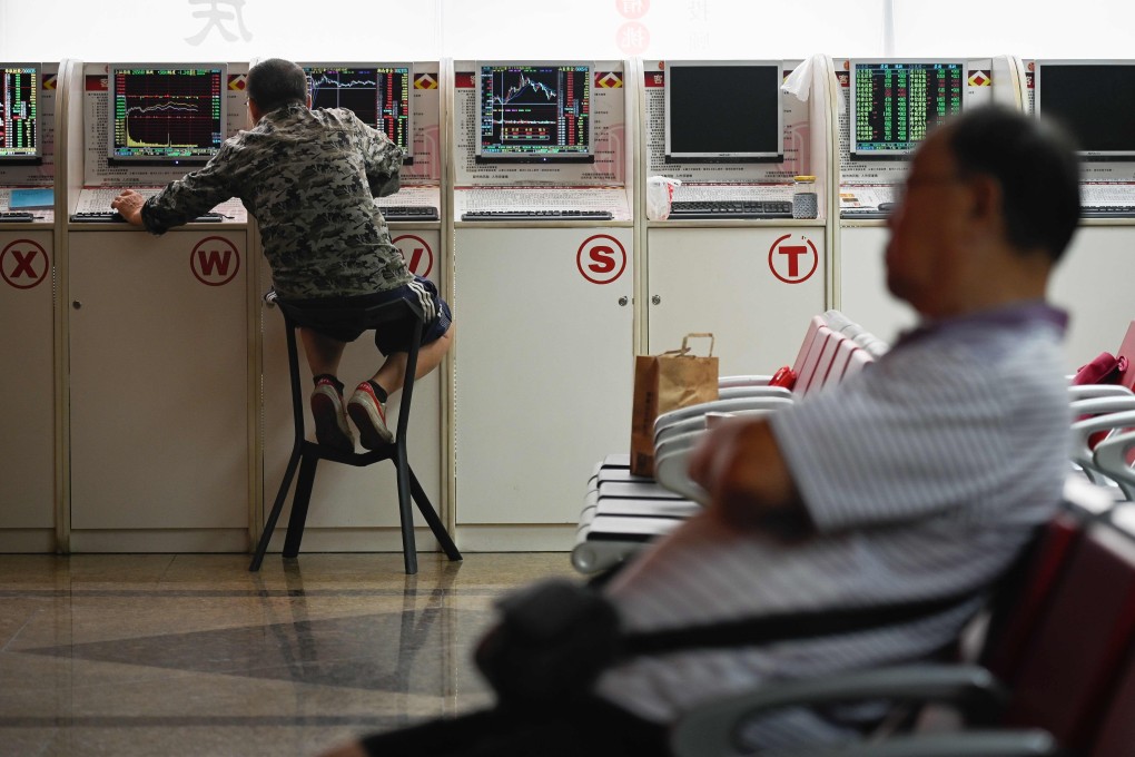 A securities company in Beijing. A weak yuan is still weighing on the mainland Chinese market, according to an analyst. Photo: AFP