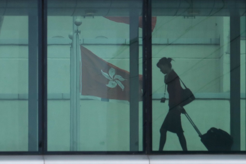 A Cathay Pacific staff member walks through Cathay Pacific City in Chep Lap Kok in May 2017. The company has been criticised for firing staff in connection with their support for the ongoing protests in Hong Kong. Photo: Felix Wong