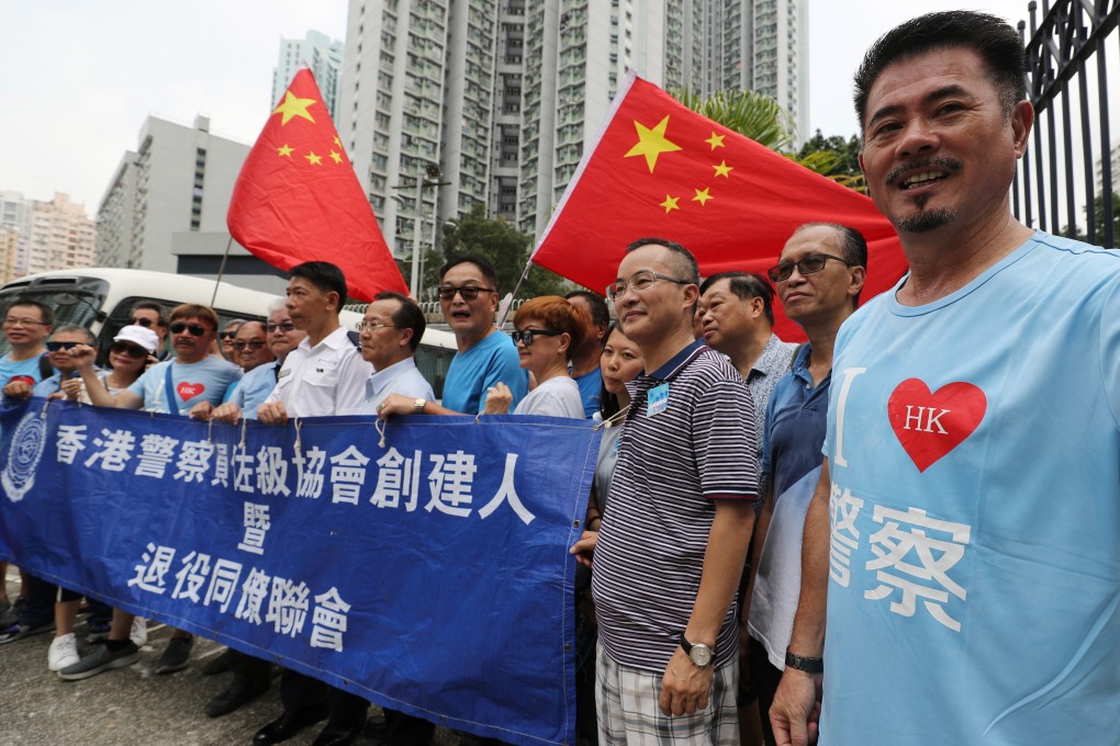 Supporters of China and the Hong Kong police carry Chinese flags at the Kwai Chung Police Station on August 10. Photo: Edward Wong