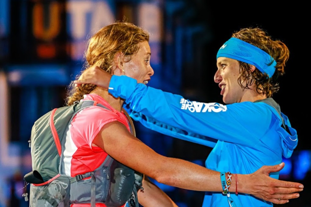 (Left) Hillary Allen and Audrey Tanguy embrace after finishing second and first respectively at the TDS, UTMB. Photo: UTMB