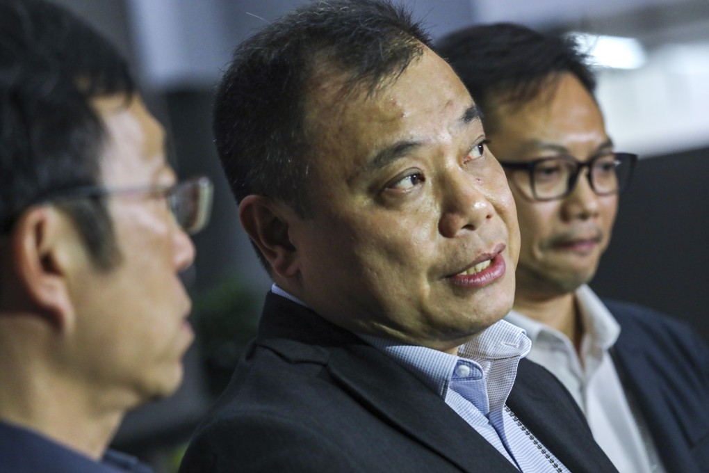 Lam Chi-wai (centre), the chairman of Junior Police Officers Association, on Thursday after meeting with the Labour and Welfare Bureau. Photo: Dickson Lee