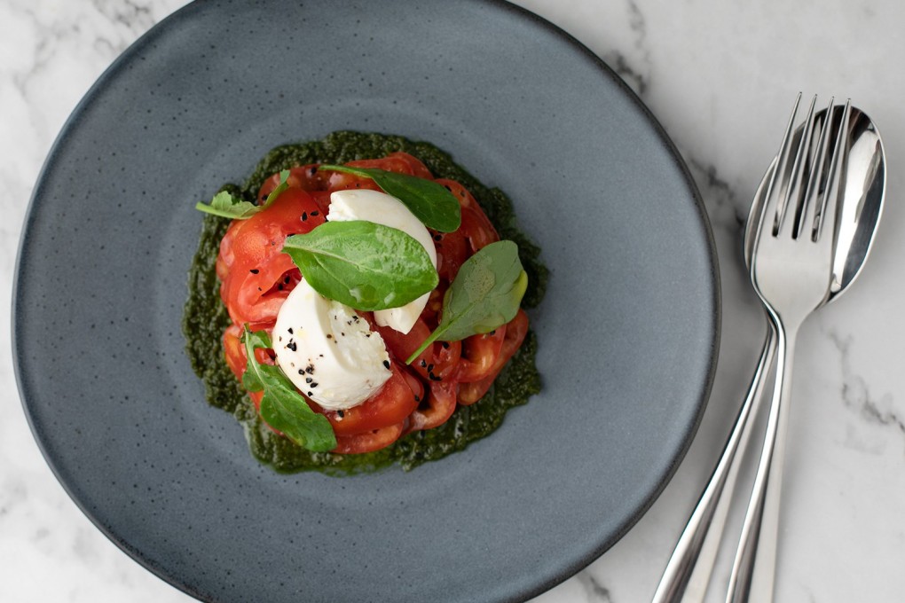 The oxheart tomato with basil pesto, rocket and burrata served at Cornerstone in SoHo is fresh and big enough to share.