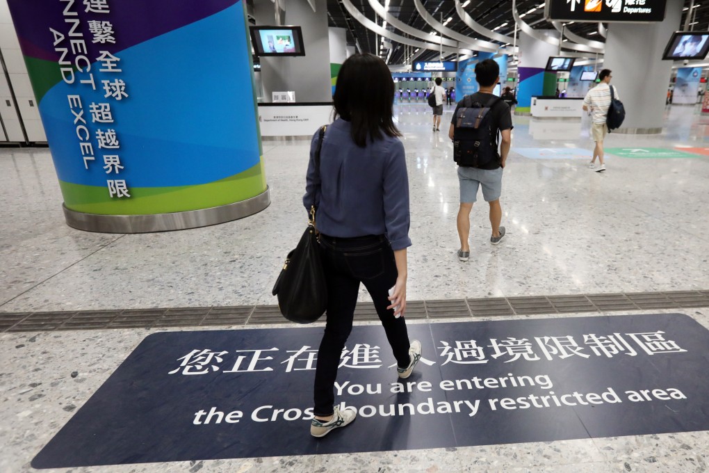 Travellers walk into the cross-boundary restricted area at the West Kowloon high-speed rail terminus, which features an immigration co-location arrangement between the Hong Kong and mainland Chinese authorities, on September 23. British consulate worker Simon Cheng was due to return to Hong Kong via this station before being reported missing. Photo: Nora Tam