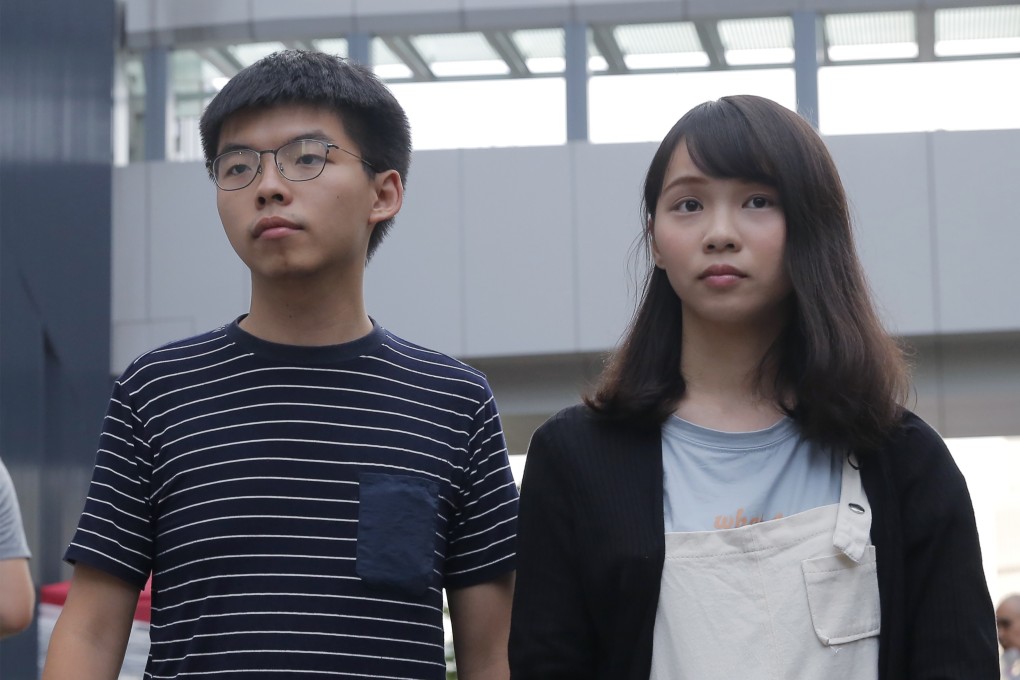 Joshua Wong and Agnes Chow are among a trio of activists arrested for their alleged roles in anti-government protests since June. Photo: AP