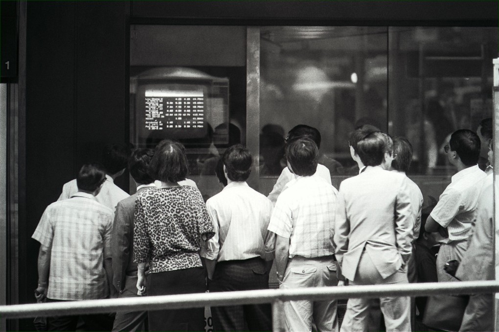 On May 22, 1989 Hong Kong stock prices suffered their heftiest one-day fall since the 1987 crash as waves of panic selling, prompted by the political crisis in China, swept through the local stock market. Pictured are anxious investors watching share prices plunge. Photo: SCMP