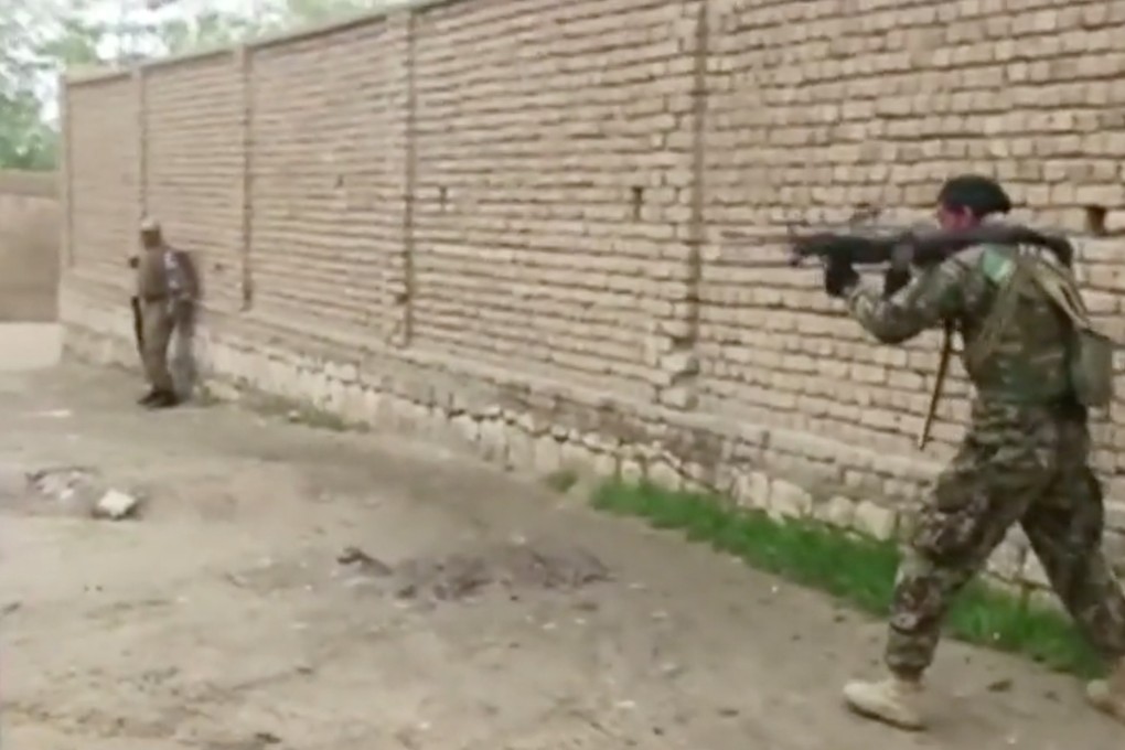 Afghan security personnel fire towards Taliban positions in Kunduz. Photo: Reuters