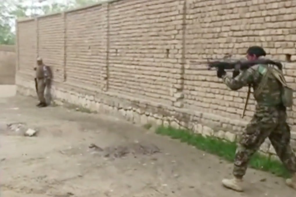 Afghan security personnel fire towards Taliban positions in Kunduz. Photo: Reuters