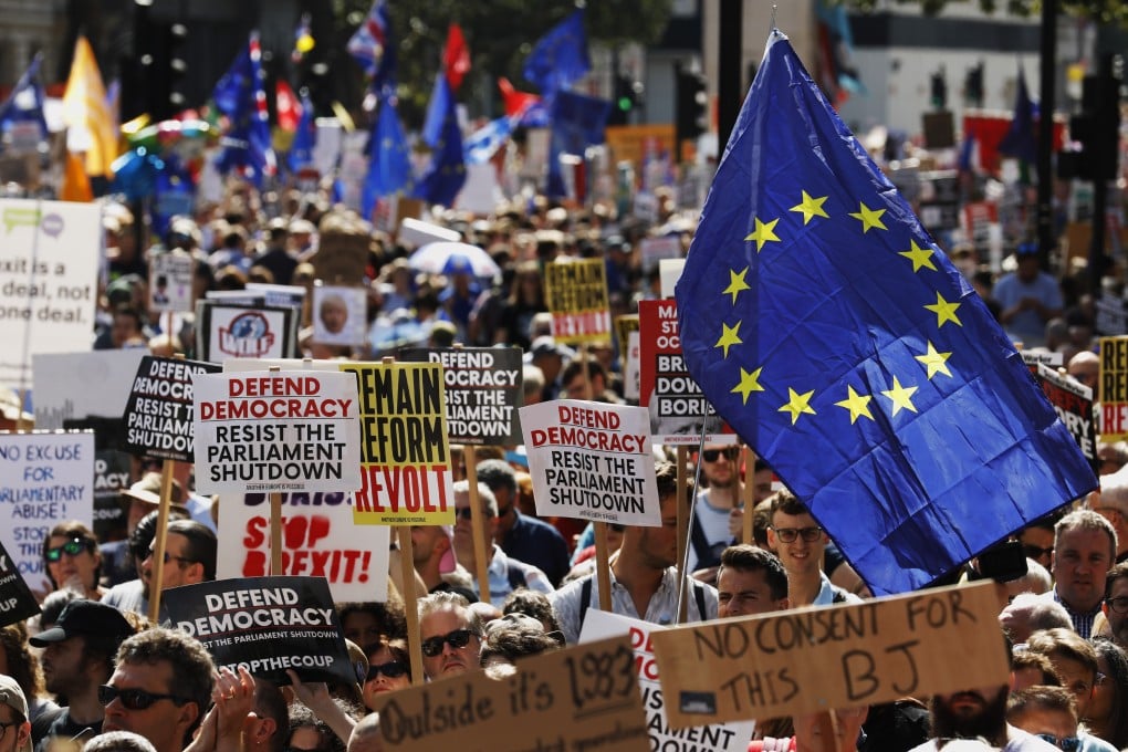 Demonstrators wave European Union flags outside Downing Street during a protest against the suspension of parliament on Saturday. Photo: Bloomberg