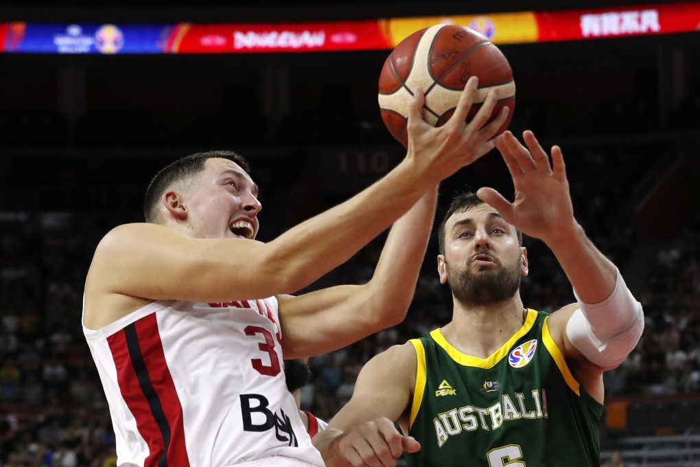 Canada’s Kyle Wiltjer in action against Australia’s Andrew Bogut in Dongguan. Photo: Reuters