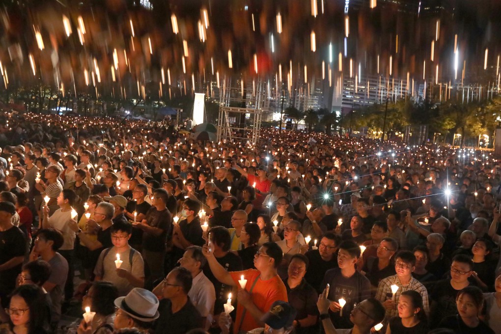 People raise their candles during a vigil at Victoria Park in Causeway Bay on June 4 to commemorate the 30th anniversary of the Tiananmen Square crackdown. Photo: Felix Wong