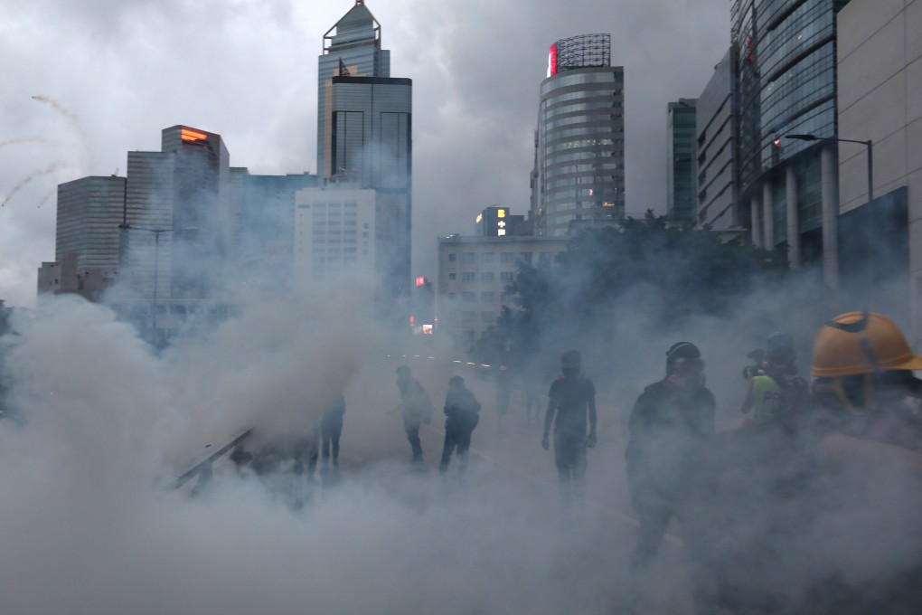 Police use tear gas to disperse anti-government protesters in Admiralty during another day of clashes on Saturday. Photo: Xiaomei Chen