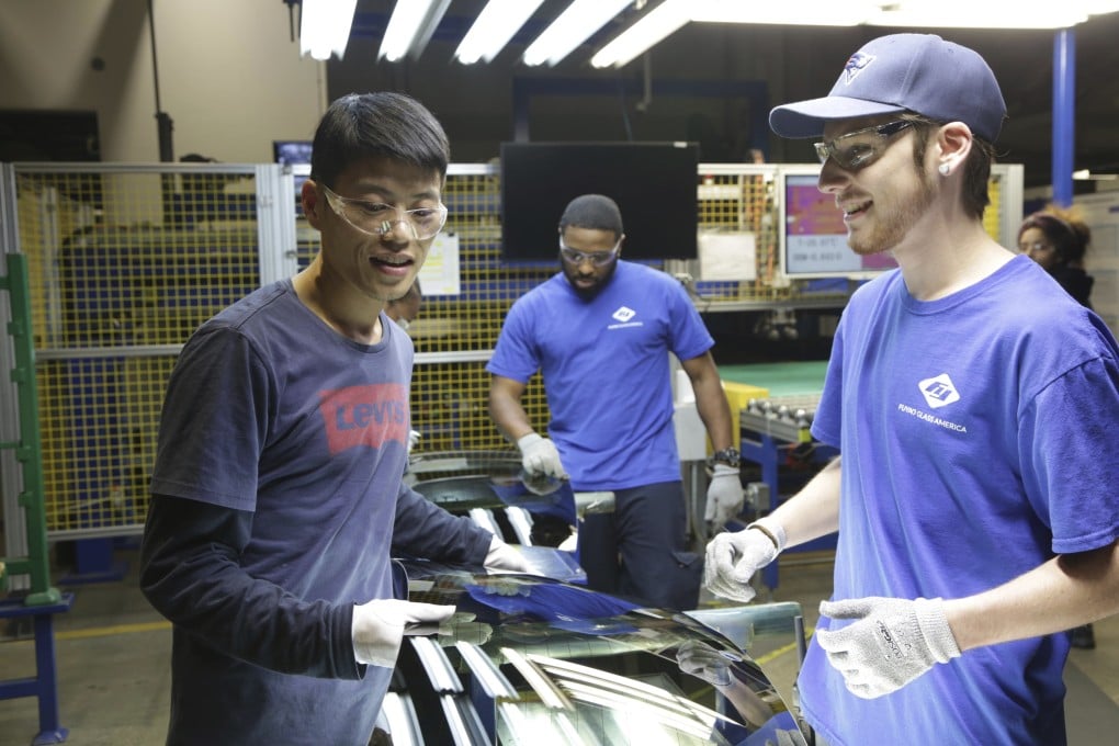 This image released by Netflix shows Wong He, left, working with Kenny Taylor, centre, and Jarred Gibson, right, in the furnace tempering area of the Fuyao Glass America Factory in Dayton, Ohio, in the documentary film, American Factory. Photo: Netflix via Associated Press