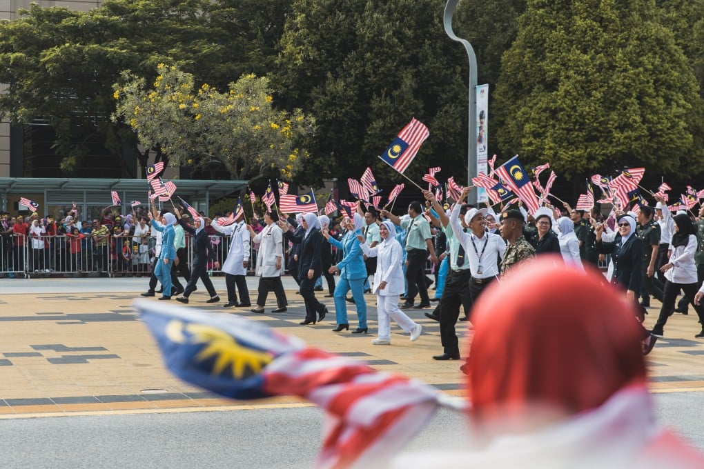 The procession for Malaysia’s Merdeka Day parade walks by. Photo: Team Ceritalah
