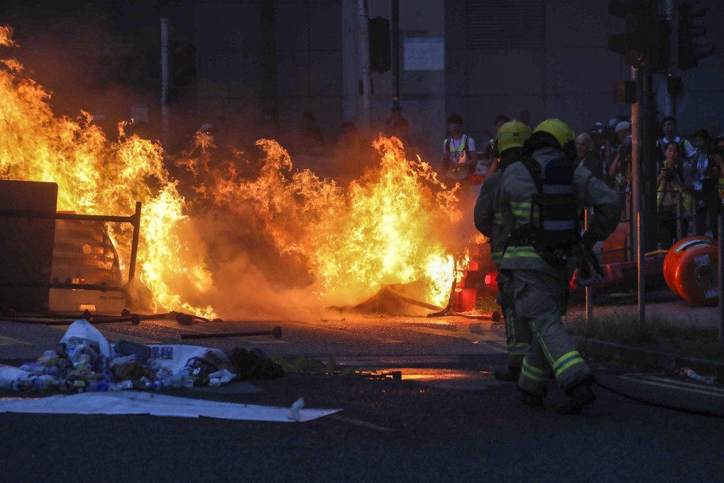 Protesters start a big fire using motor oil near the Citygate mall in Tung Chung on Sunday. These protests since June have deterred tourists and affected the city’s tourism industry. Photo: Felix Wong