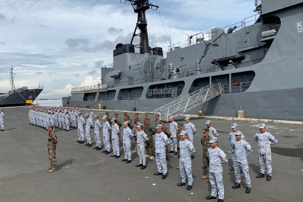 Philippine navy personnel stand in formation during a send-off ceremony. Photo: EPA