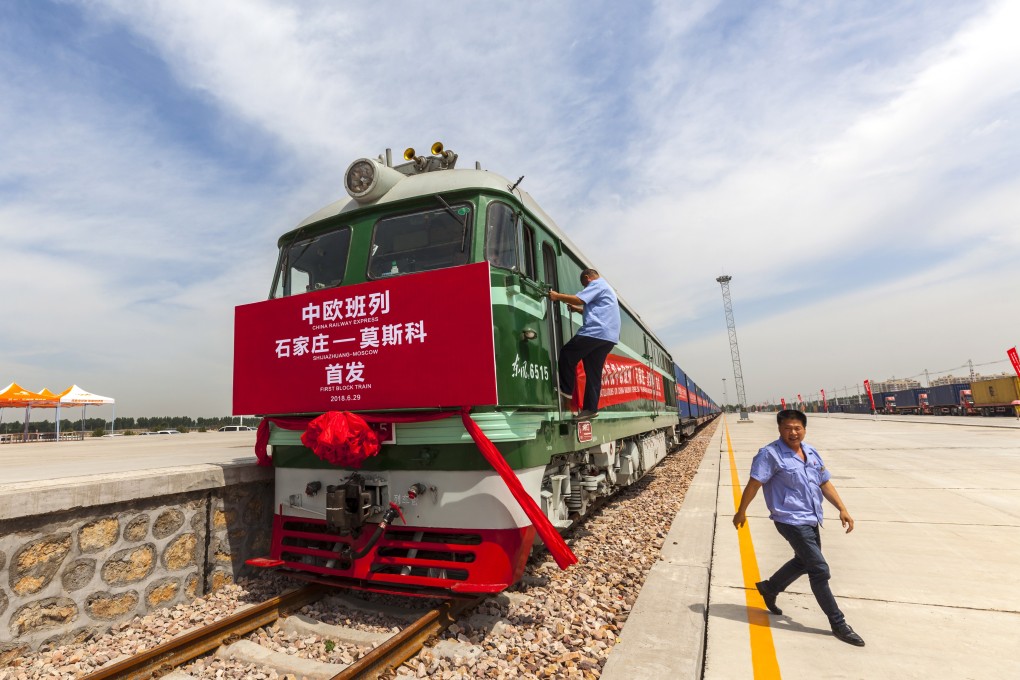 Workers prepare the first block train for departure from Shijiazhuang, China to Moscow last year. Russia was identified as a country that would have to reduce its carbon emissions by 68 per cent by 2050. Photo: EPA-EFE