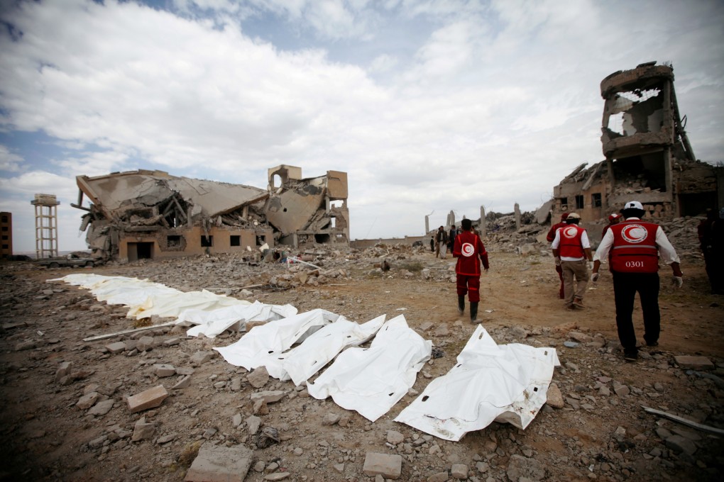 Red Crescent medics walk next to bags containing the bodies of victims of Saudi-led air strikes on a detention centre in Dhamar, Yemen. Photo; Reuters