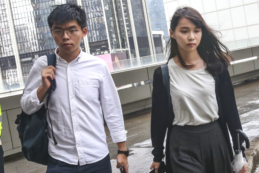 Joshua Wong and Agnes Chow at the High Court on Tuesday. The activists were arrested on August 30, a day ahead of a mass protest rally. Photo: David Wong