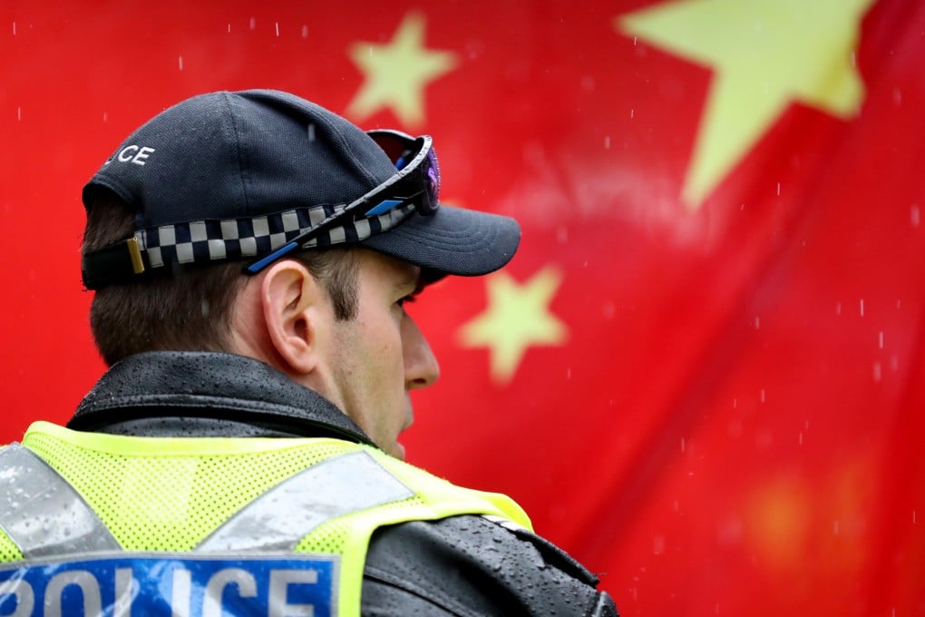 A police officer in front of a Chinese flag during a pro-democracy Hong Kong rally in Adelaide, Australia, on August 18. Such protests have prompted clashes between pro-Hong Kong and pro-China student activists at Australian universities. Photo: EPA-EFE