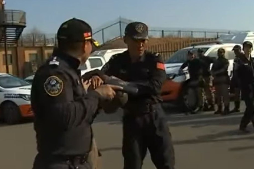 Chinese specialists demonstrate how to restrain a suspect. Photo: YouTube