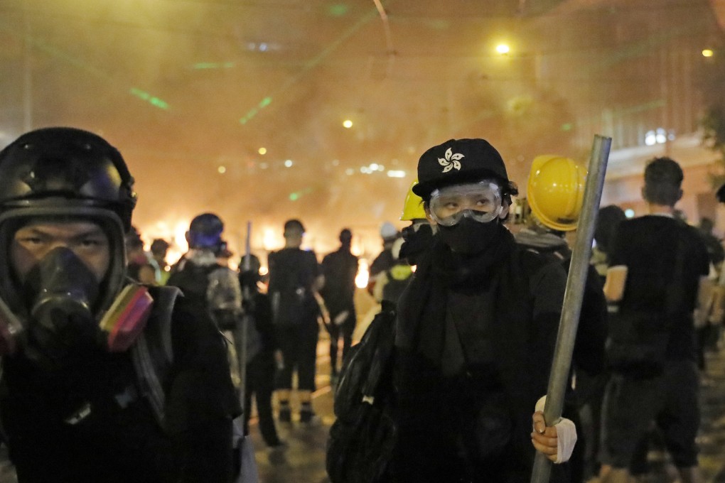 Protesters face police in Hong Kong’s Causeway Bay on Saturday. Photo: AP