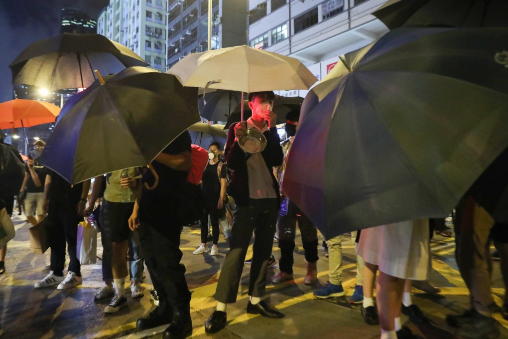 Protesters earlier block the Tsim Sha Tsui-bound lane of Nathan Road. Photo: Sam Tsang