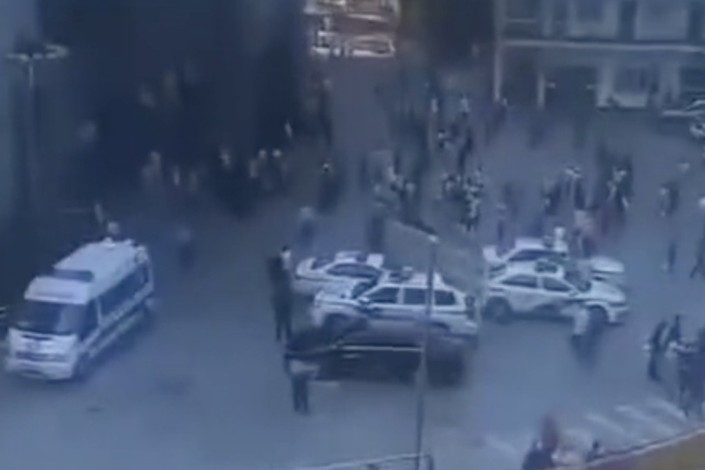 Police vehicles attend the scene of a stabbing attack in Baiyangping. Photo: Miaopai