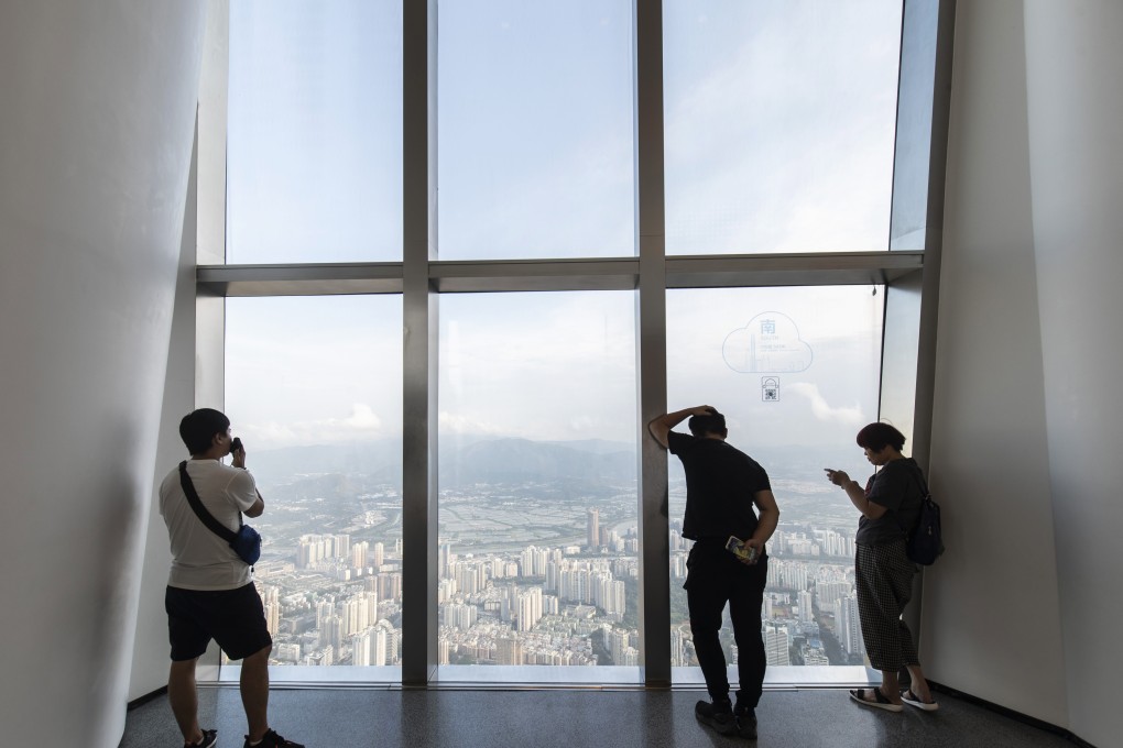 Visitors look at Shenzhen from an observation deck in the city. The CMC Reit portfolio will initially comprise five properties in the city’s Shekou subdistrict. Photo: Bloomberg