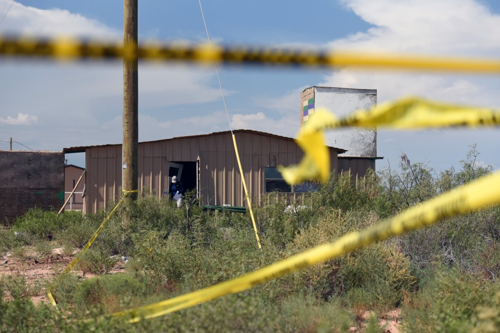 An FBI agent investigates the home of Seth Ator following the shooting. Photo: Reuters