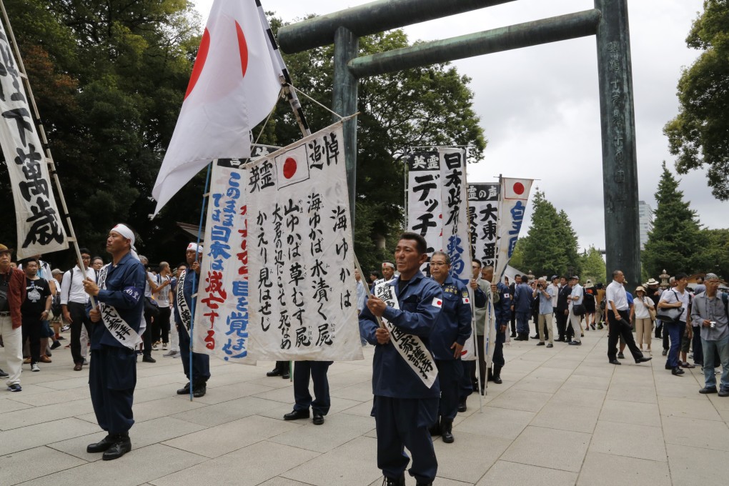 Members of a right-wing group visit the Yasukuni Shrine. Photo: AP