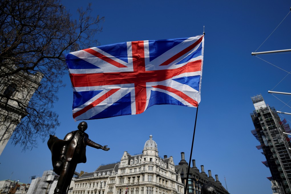A British flag flutters during the March to Leave demonstration in Parliament square in London on March 29. Photo: Reuters