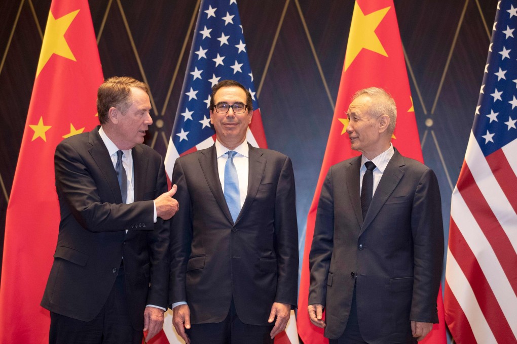 US Trade Representative Robert Lighthizer and US Treasury Secretary Steven Mnuchin pose for a photo with Chinese Vice-Premier Liu He in Shanghai on July 31. Within 48 hours of this picture, when progress in negotiations was apparent, the trade war between the US and China escalated with the announcement of fresh tariffs. Photo: AFP