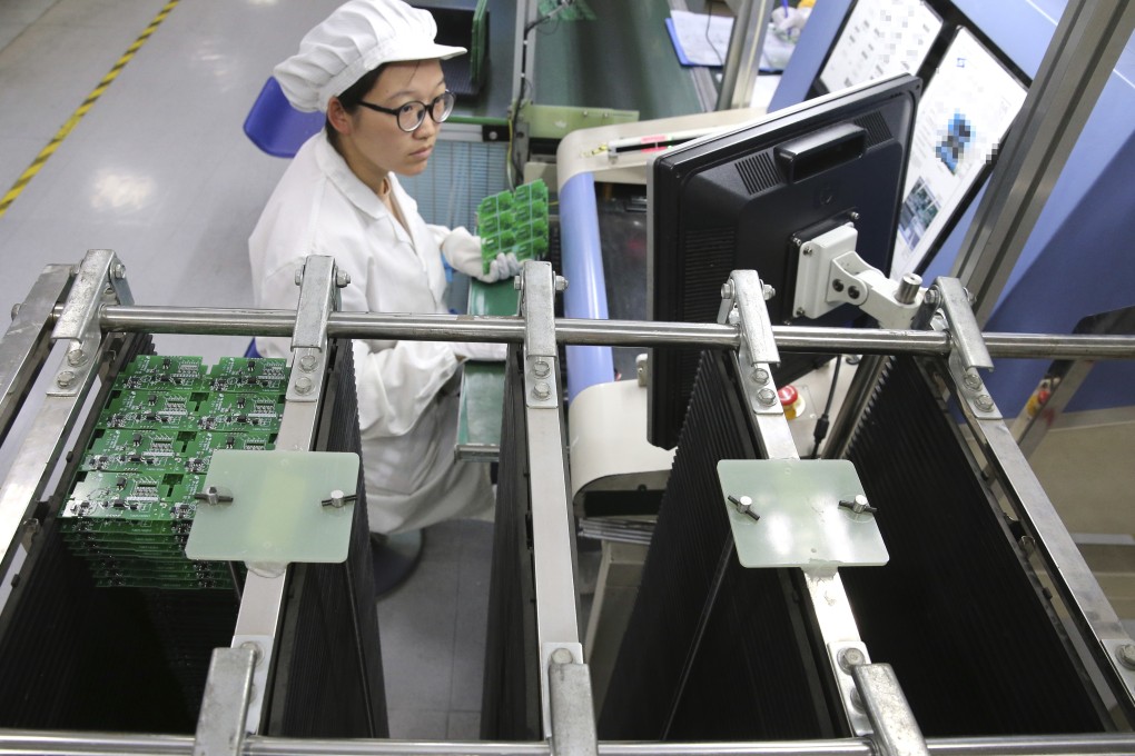 An employee works on the production line of a smart electricity meter manufacturing plant in Nantong in eastern China's Jiangsu province. Photo: AP