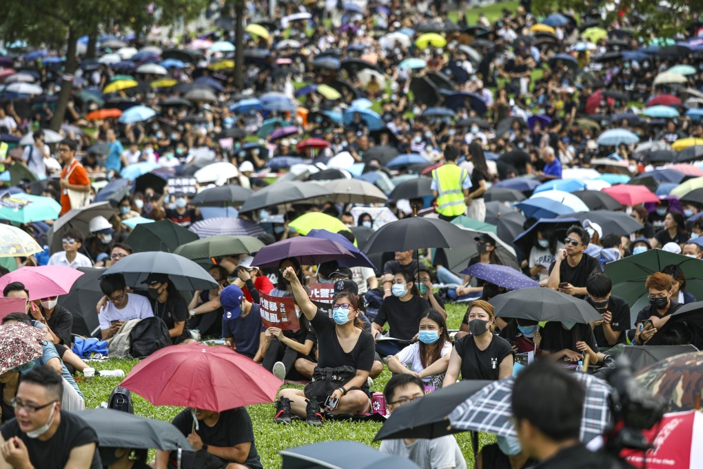 Rally-goers return to Tamar Park, Admiralty. Photo: Tory Ho