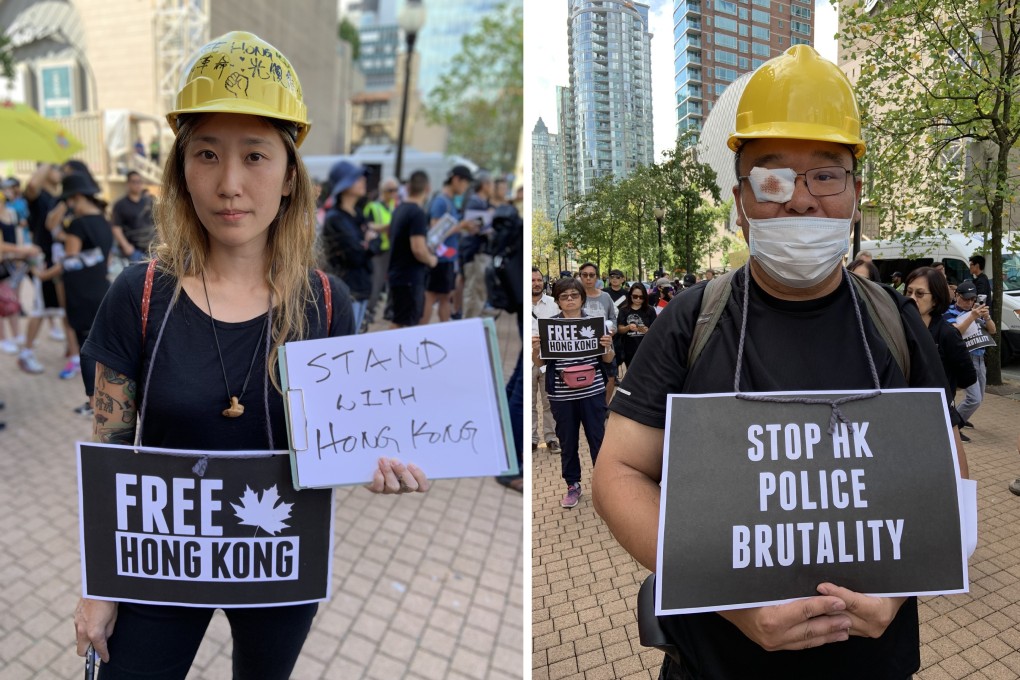 Jayers Ko (left) and a protester who did not want to be identified at a rally outside the Vancouver Public Library on Saturday. Photos: Ian Young