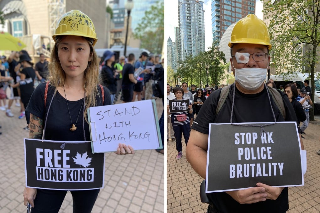 Jayers Ko (left) and a protester who did not want to be identified at a rally outside the Vancouver Public Library on Saturday. Photos: Ian Young
