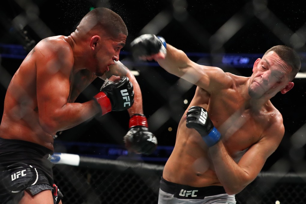Nate Diaz throws a punch at Anthony Pettis. Photo: AFP