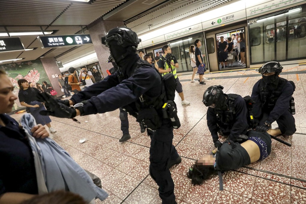 Riot police arrest an anti-government protester in Prince Edward MTR station on August 31. Police officers from the Special Tactical Square, known as “raptors”, stormed into a train at the station, hitting and pepper-spraying people. Photo: Handout