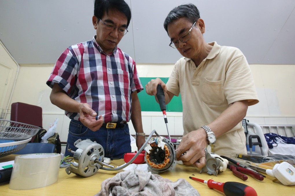 Volunteers Siu Wing-kai (left), 70 years old, and 60-year-old Lee King at the Repair Cafe in Tai Po. Photo: David Wong