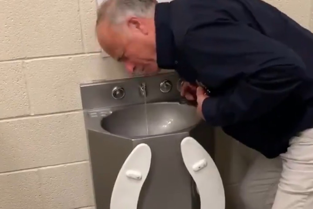 US congressman Steve King drinks from water fountain at the back of a hybrid toilet at a migrant detention facility in Texas. Photo: Steve King via Twitter