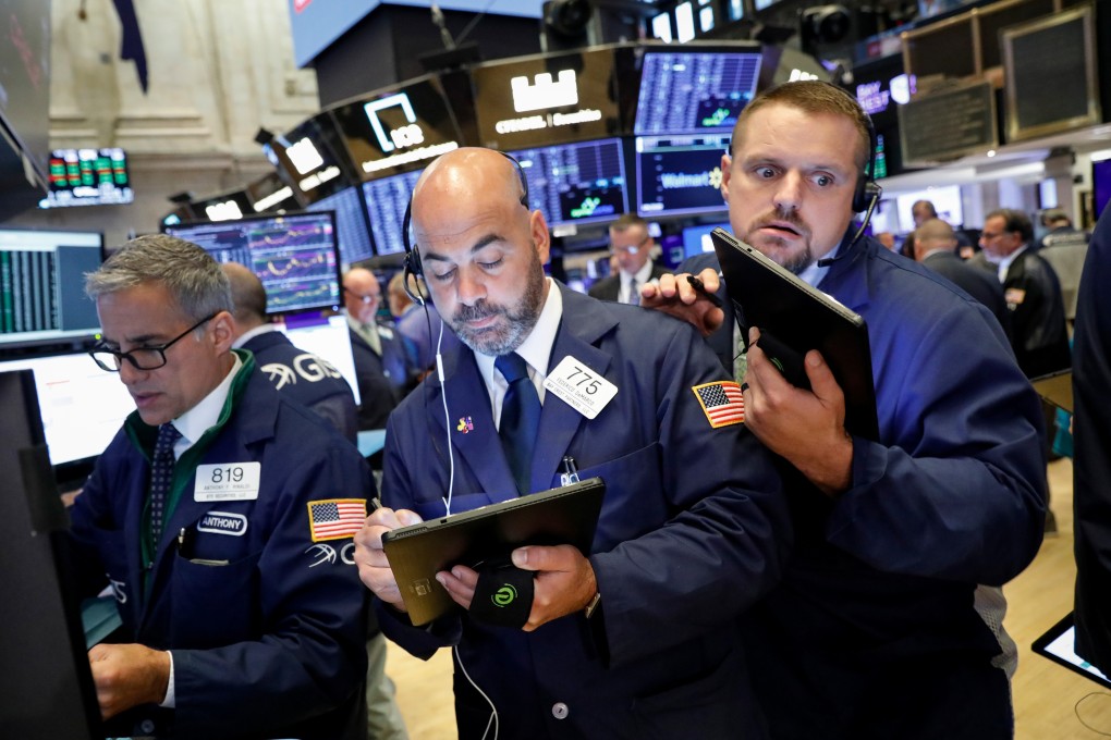 Traders work on the floor at the New York Stock Exchange on Thursday. Photo: Reuters