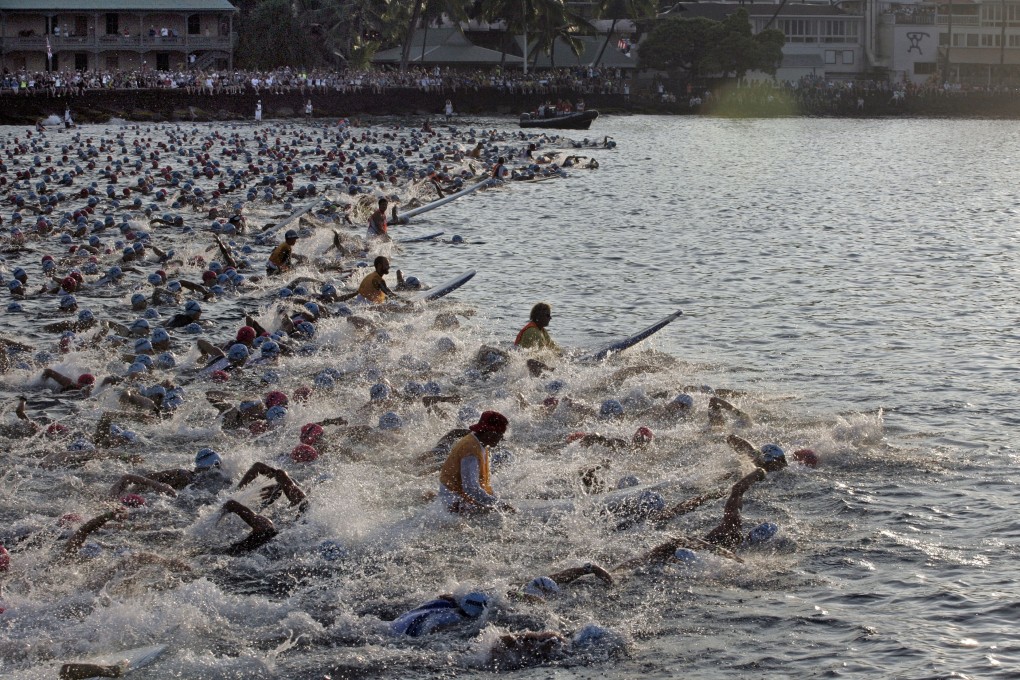 The early morning swim in Kailua Bay during the Ironman World Championship triathlon Kailua-Kona, Hawaii. Photo: AP Photo/Chris Stewart