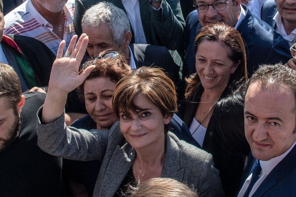 Turkish opposition party leader Canan Kaftancioglu leaving court on Friday, surrounded by supporters. Photo: AFP
