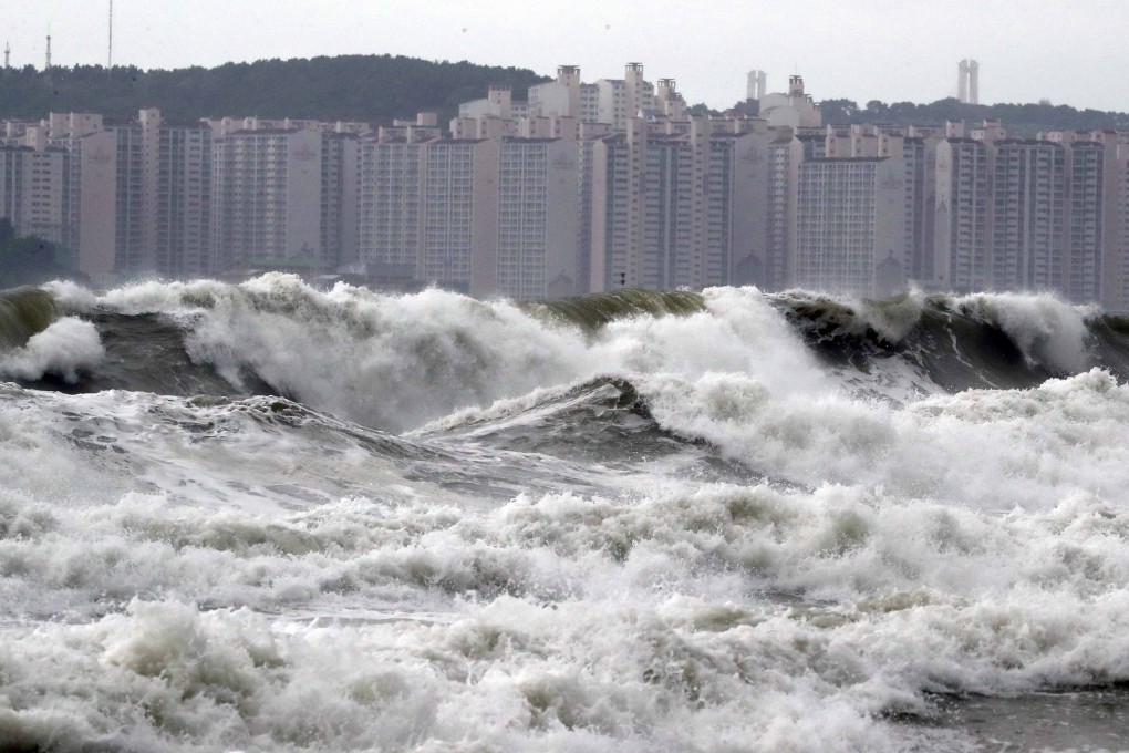 High waves batter a beach in the South Korean port city of Busan on Saturday. Photo: AFP
