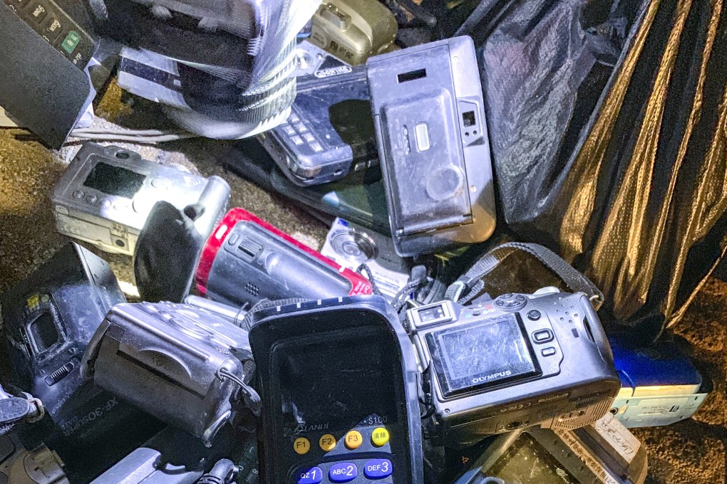 The night market is full of second-hand electronic devices such as radios and dumbphones. Photo : SCMP