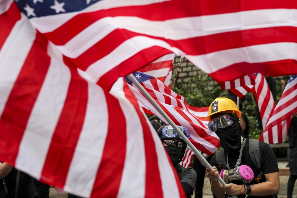 Anti-extradition bill protesters wave stars and strips flags as they march to the US Consulate on September 8 to urge support for the Hong Kong Human Rights and Democracy Act. Photo: Sam Tsang