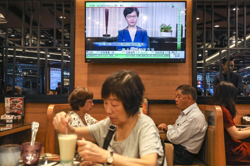 A television shows the broadcast in which Carrie Lam announced she would withdraw the extradition legislation, news which mainland media downplayed. Photo: Robert Ng