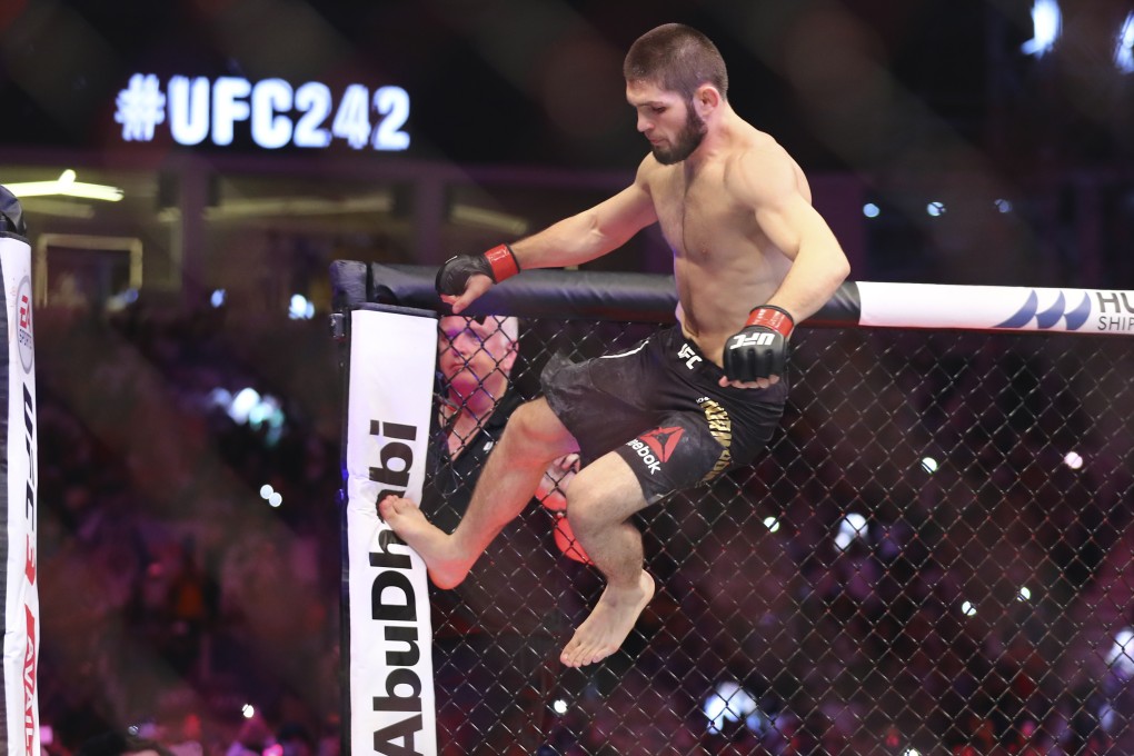 Khabib Nurmagomedov vaults the Octagon to celebrate his victory against Dustin Poirier at UFC 242. Photo: AP